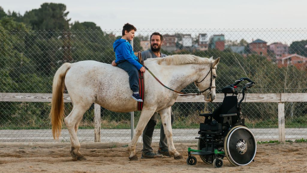 Child during horse therapy session